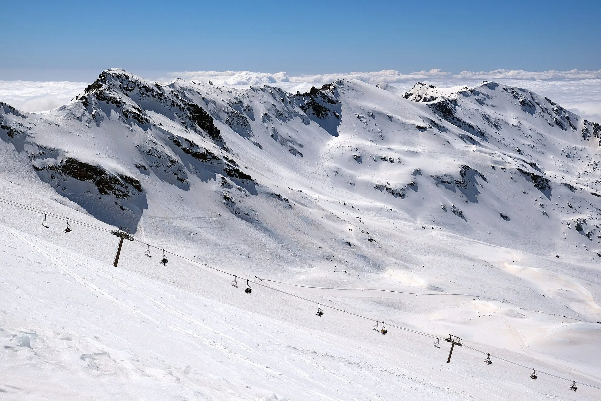 The snow-capped peaks of the Sierra Nevada and the ski-lift lines